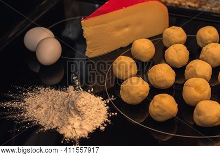Home Made, Cheese Bread Preparartion And Ingrediets On Black Background.