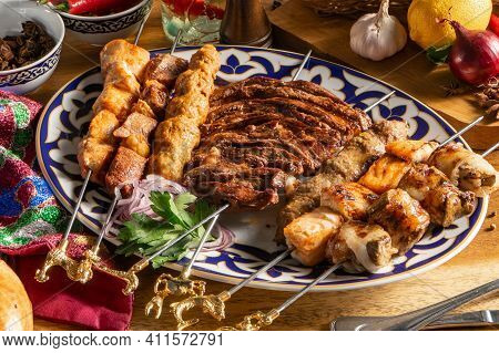 A Large Set Of Different Types Of Shish Kebab On A Traditional Uzbek Plate. Shish Kebab Of Lamb, Chi