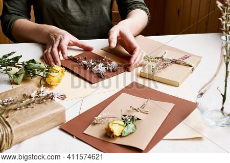 Woman Makes Zero Waste, Plastic Free, Trendy Hand Made Gift Card With Craft Recycled Paper And Dried