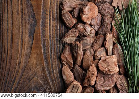 Pine Bark And Branch Of Pine Tree On Wooden Board, Top View. Natural Background.