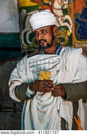 Yeha, Ethiopia - Feb 10, 2020: An Orthodox Priest The Great Temple Of The Moon, Privy To Walia Ibex 
