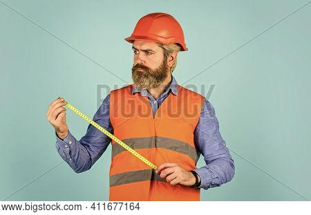 Worker Use Tape Measure. Size Concept. Hipster In Hard Hat. Make Measurements Apartment Renovation. 