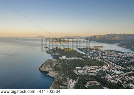 Aerial Drone Shot Of Lapad Hill In Dubrovnik Town With Sunrise Over The Peak In Croatia Summer Morni