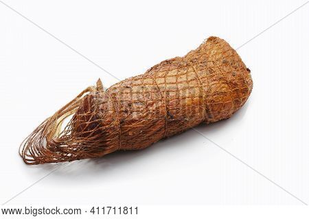 Smoked Loin, Sirloin In Herbs In One Piece, In Netting, Isolated On A White Background. A Homemade, 