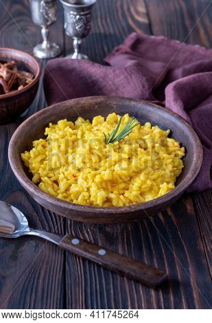 Portion Of Saffron Risotto With Fried Chanterelles