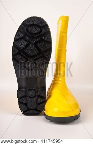 Robust And Waterproof Yellow Rubber Boots Isolated On White Background