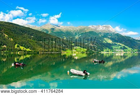 Inflatable Boats On Reschensee, An Artificial Lake In South Tyrol, The Italian Alps