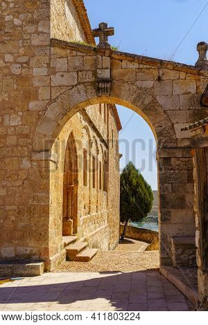 Stone Arch Next To Old Church In Segovia Town. Maderuelo Spain.