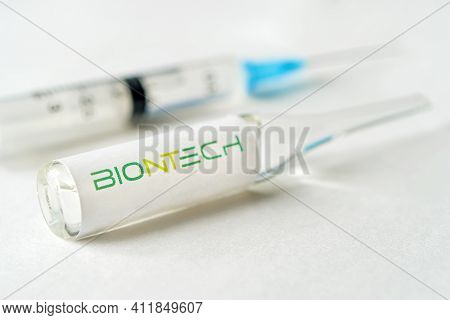 Glass Bottle With Logo Biontech, German Pharmaceutical Company. January 18, 2021, Barnaul, Russia.