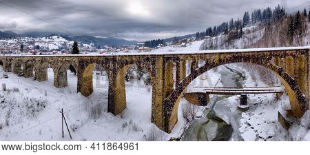 Large Arch Of A Brick Bridge. Old Prewar Bridge. Winter.