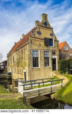 Old Historic House At The Narrow Canal Of Hindeloopen, Netherlands