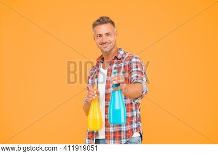 Ready To Spray. Happy Man Hold Spray Bottles Yellow Background. Spray Cleaning. Trigger Sprayer Disp