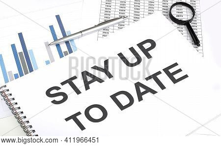 In The Notebook, The Text Stay Up To Date, Next To Magnifier And Pen, The Background Is Graphics.