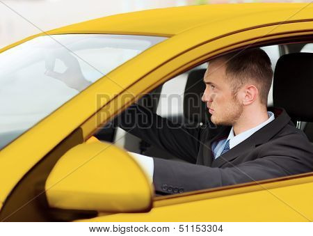 transportation and vehicle concept - businessman or taxi driver driving a car