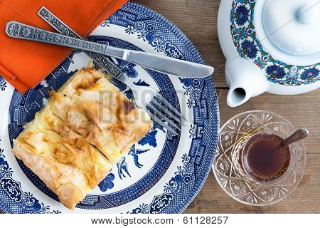 Slice Of Turkish Borek Served With A Cup Of Tea