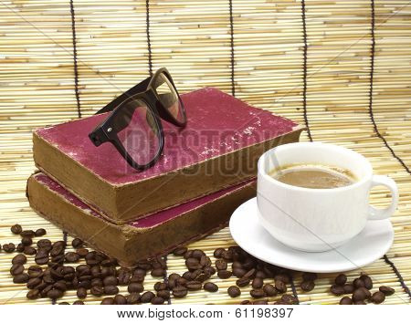 Old Book And Glasses On Bamboo