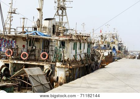 AGADIR, MAROCCO - AUGUST 27: View of fishing boats in Essaouira port on 27 August 2014 in Agadir, Marocco. Morocco is one of the largest producers of sardines in the world.