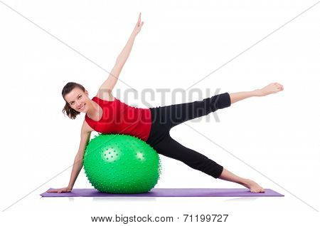 Young woman exercising with swiss ball