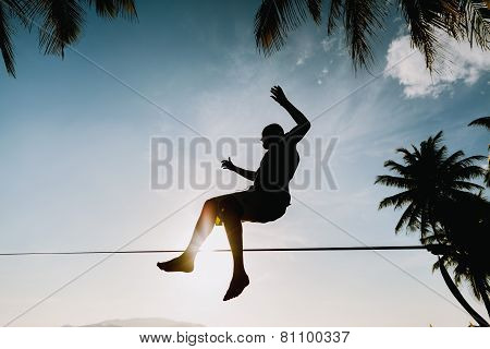 Teenage Jumping On Slackline