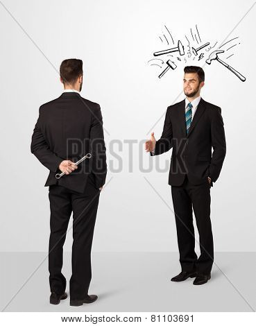 Ruthless businessman hiding a weapon white drawn beating hammer marks 