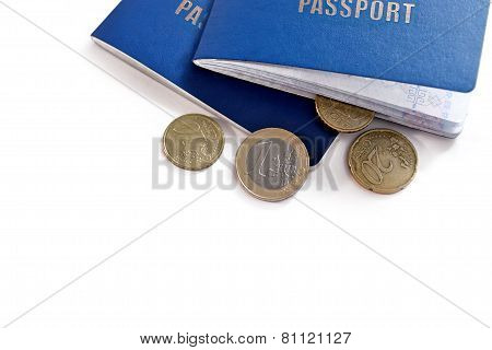 Two passports and euro money coins on white