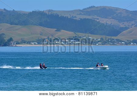 People Water Skiing Over Mercury Bay New Zealand