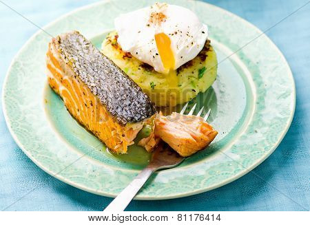 The Fried Salmon With A Potato Patty And Poached Egg