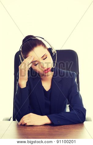 Portrait of anoyed support phone operator in headset