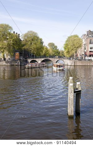 Boats On Amstel And Herengracht In Amsterdam