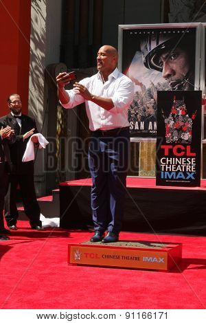 LOS ANGELES - MAY 19:  Dwayne Johnson, The Rock at the Dwayne Johnson Hand and Foot Print Ceremony at the TCL Chinese Theater on May 19, 2015 in Los Angeles, CA