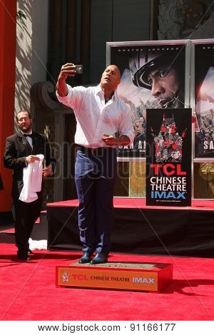 LOS ANGELES - MAY 19:  Dwayne Johnson, The Rock at the Dwayne Johnson Hand and Foot Print Ceremony at the TCL Chinese Theater on May 19, 2015 in Los Angeles, CA