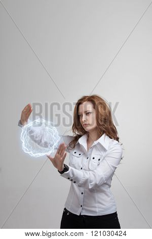 Woman with glowing magical energy ball.
