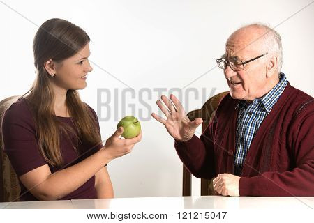 Young Woman Helps Senior Man