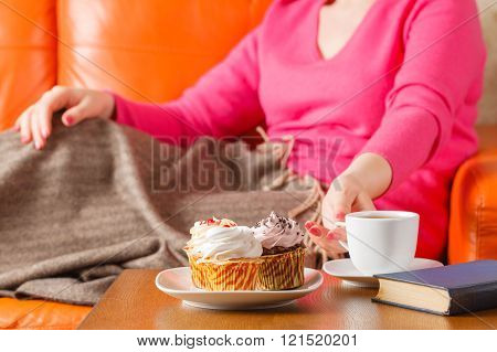 Woman Eat Cupcakes And Drink Tea