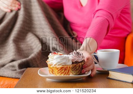 Woman Eat Cupcakes And Drink Tea