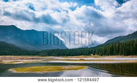 Mountain Valley Waterway. Hyalite Reservoir, Montana, USA. Landscape Background with Copy Space.