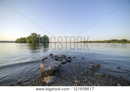 Forest Lake Under Blue Cloudy Sky