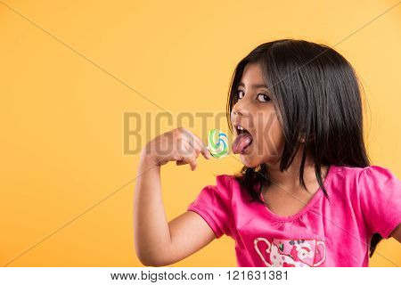 indian small girl with lollipop or loly pop, asian girl and lollipop or lolypop