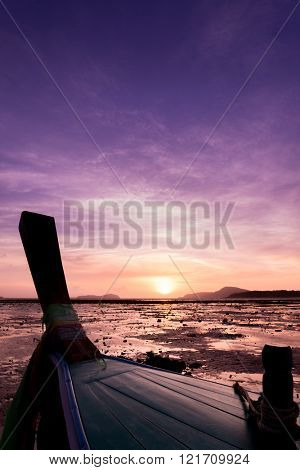 Long tail fishing boats at sunet in Thailand