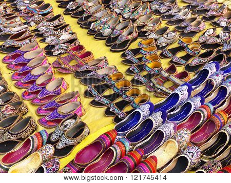Display of traditional shoes at the street market in Jaipur, India