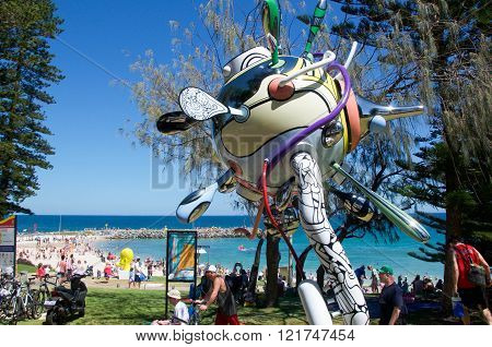 COTTESLOE,WA,AUSTRALIA-MARCH 12,2016:  Whimsical sculpture overlooking the tourists enjoying the interactive public arts festival Sculptures By The Sea at Cottesloe Beach in Cottesloe, Western Australia.
