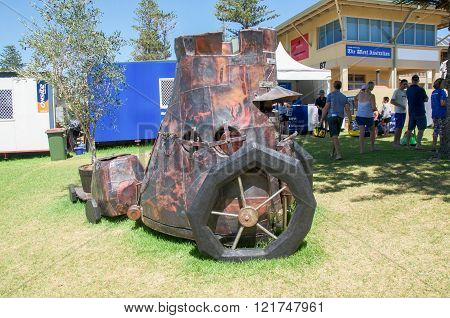 COTTESLOE,WA,AUSTRALIA-MARCH 12,2016: Steam punk patchwork metal cart sculpture with tourists at the 