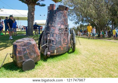 COTTESLOE,WA,AUSTRALIA-MARCH 12,2016: Metal cart patchwork sculpture with tourists at the 