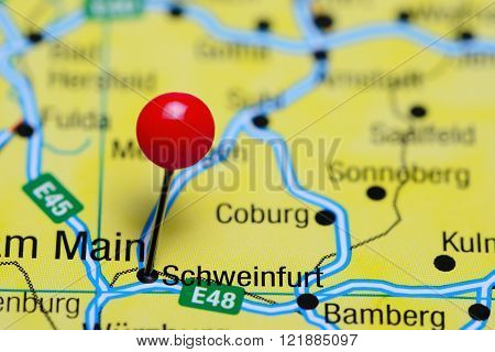 Photo of pinned Schweinfurt on a map of Germany. May be used as illustration for traveling theme.
