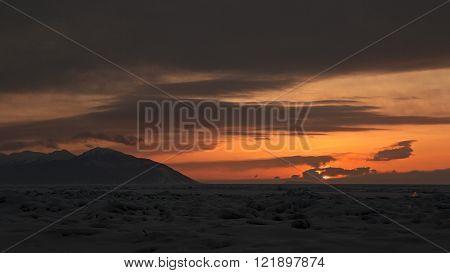 Sunset on a background of the Holy Nose Peninsula.