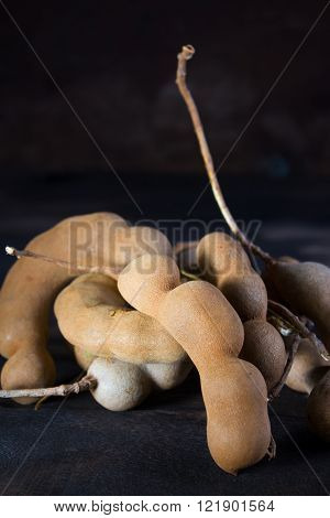 Asia Fruit : Fresh tamarind on wood
** Note: Shallow depth of field