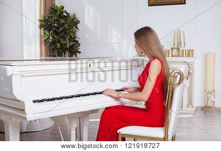 Sexy stylish blonde beautiful woman in red dress