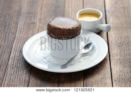freshly baked chocolate souffle with creme anglaise, french dessert