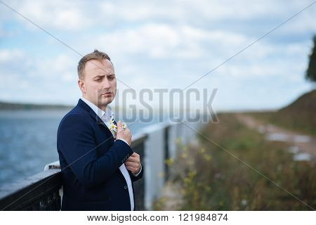 portrait of middle aged businessman walking in the nature