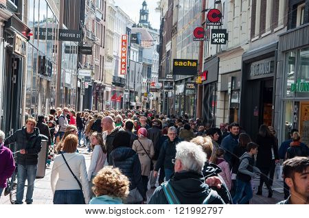 AMSTERDAM-APRIL 30: Kalverstraat shopping street people go shopping on April 30 2015. The Kalverstraat is a busy shopping street of Amsterdam the capital of the Netherlands.